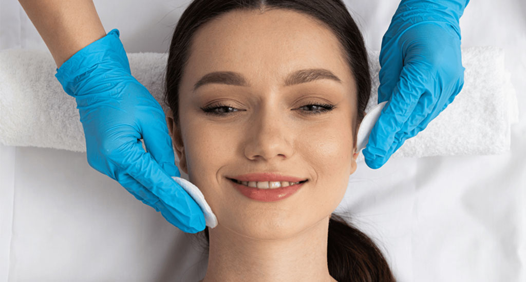 woman receiving a rejuvenating facial treatment