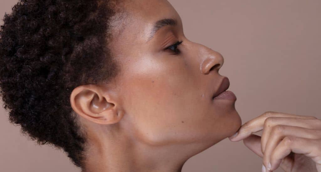 woman touching chin