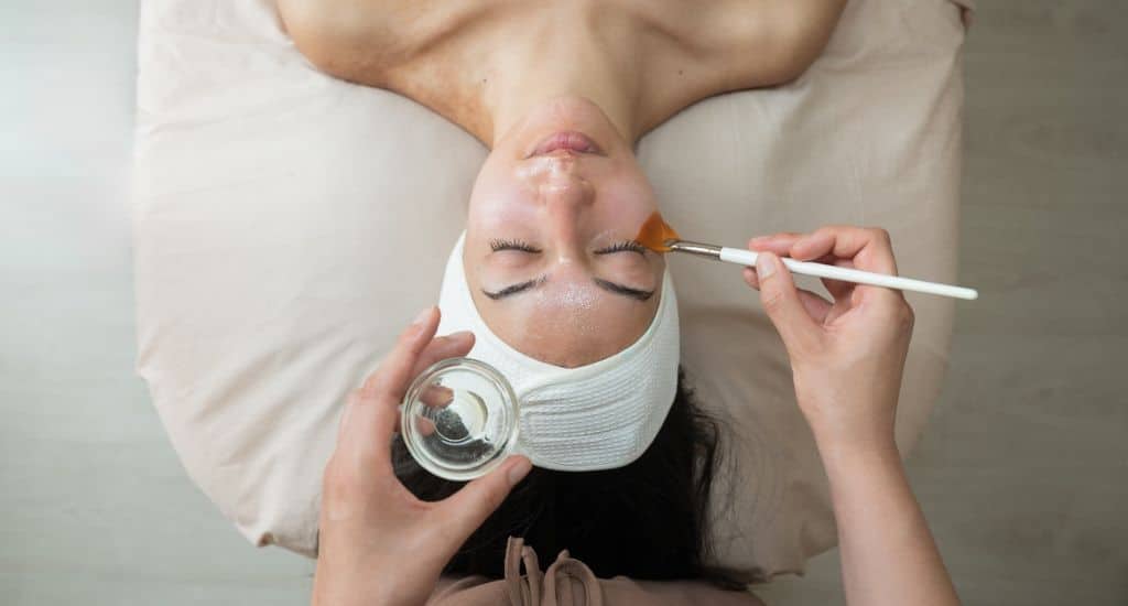 woman receiving a facial treatment